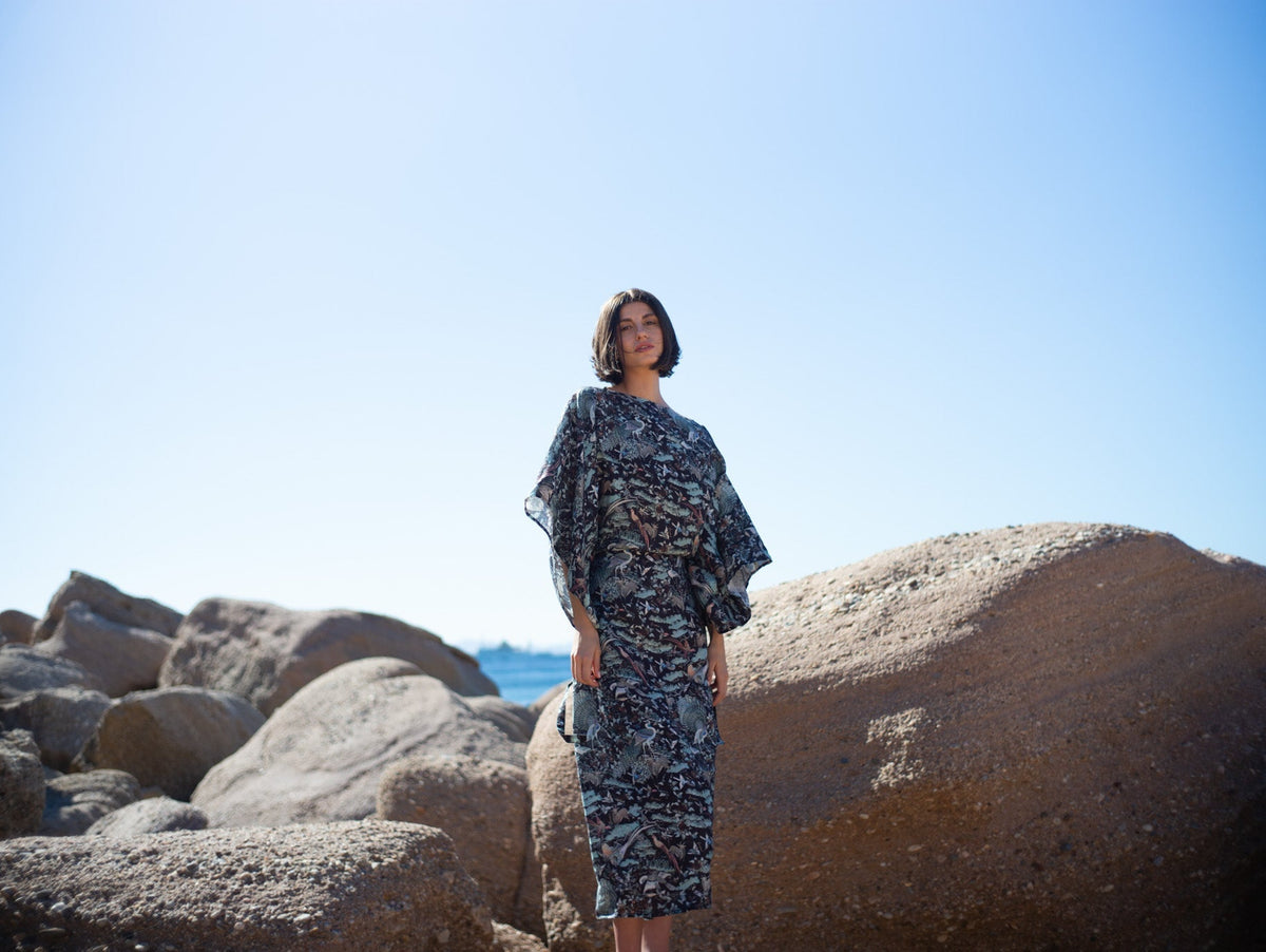Woman wearing the LUXMII Kimonos Dress in Najeon Print in the sunshine